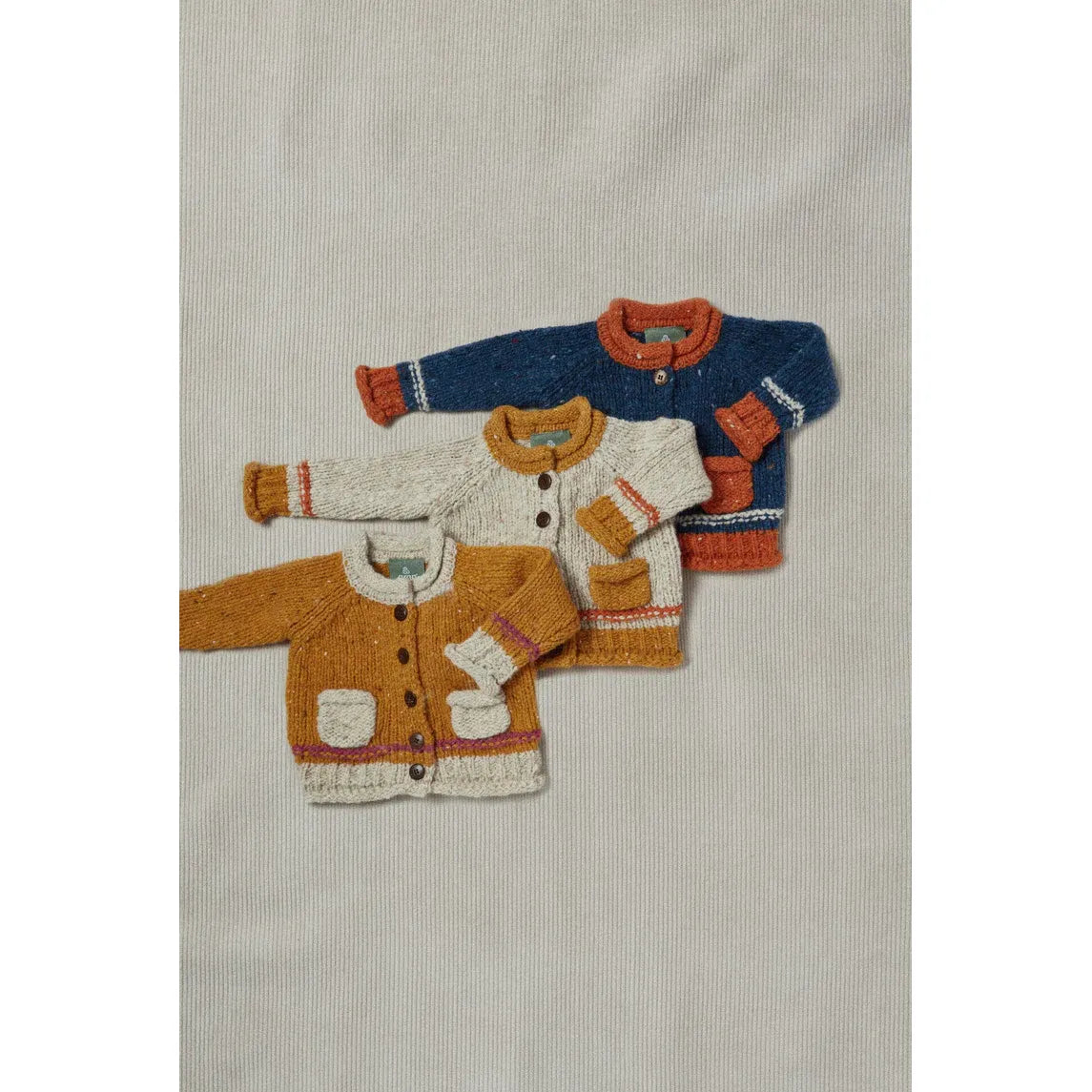 Réalta Aran Woollen Mills Baby Roll Neck Cardigan with Orange pockets
