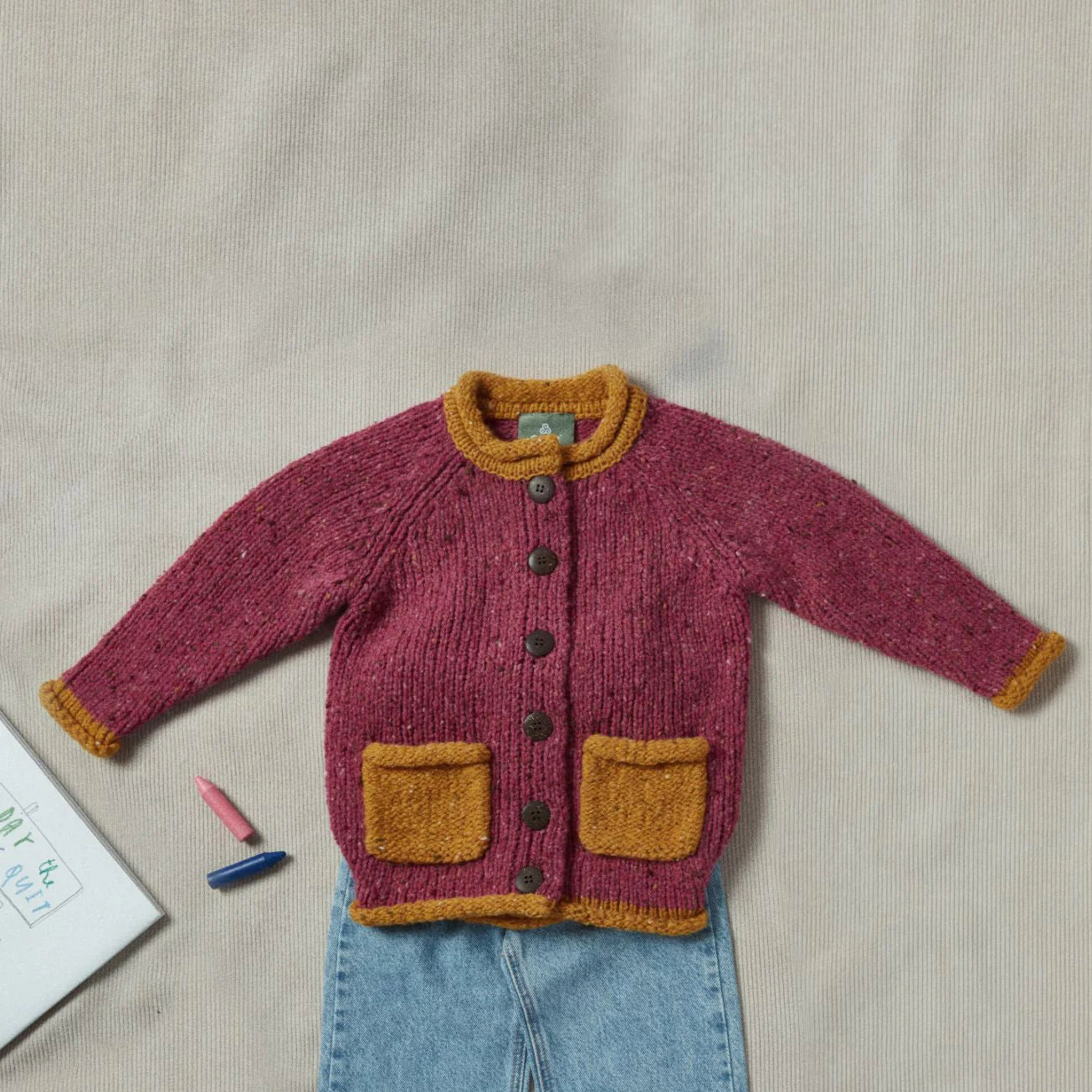 Aran Woollen Mills Solas Children’s Roll Neck Cardigan Rose Haze