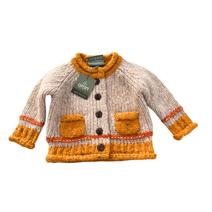 Réalta Aran Woollen Mills Baby Roll Neck Cardigan with Orange pockets